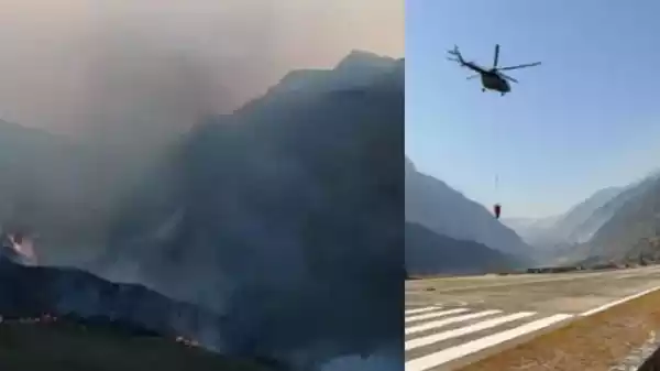 Indian Air Force helicopter dropping water to control forest fires in Northeast India Indian Air Force helicopter dropping water to control forest fires in Northeast India