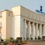 Odisha Assembly building with lawmakers silhouette and salary chart showing withdrawn hike proposal