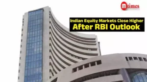 Traders on the NSE floor as Sensex and Nifty close higher