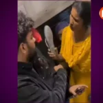 Passengers arguing over a seat inside a crowded Indian train coach