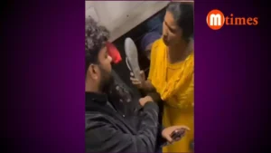 Passengers arguing over a seat inside a crowded Indian train coach
