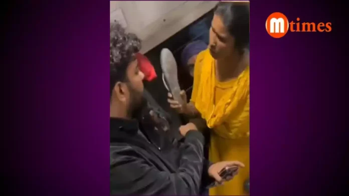 Passengers arguing over a seat inside a crowded Indian train coach