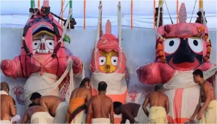 Lord Jagannath, Lord Balabhadra and Devi Subhadra during the Snana Yatra ritual at the Snana Mandap in Puri
