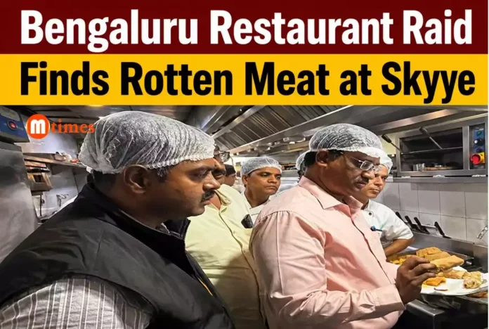 Food safety officials inspect the kitchen of a Bengaluru restaurant during a food safety raid.